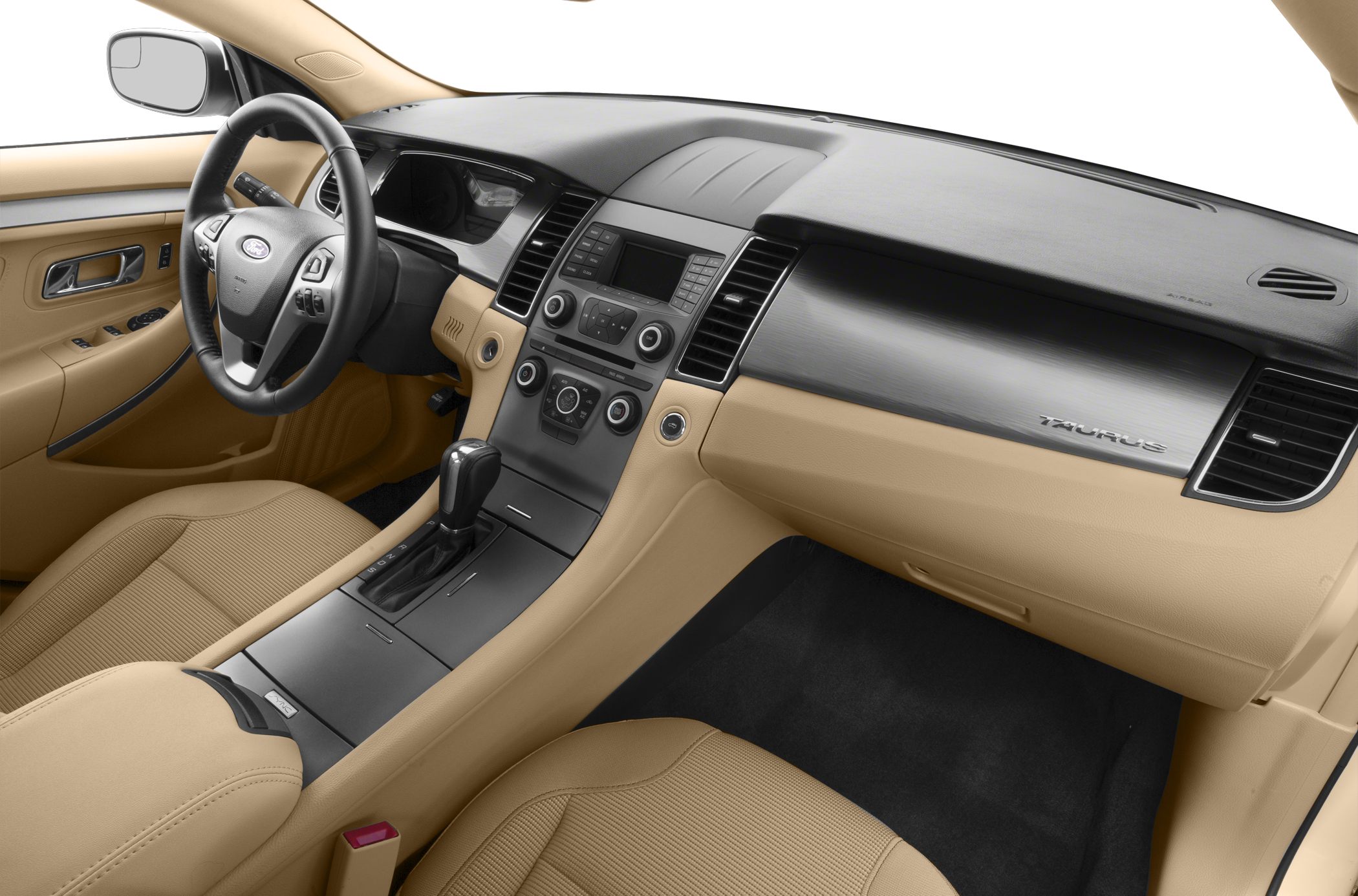 Interior dashboard and center console with beige upholstery and automatic gearshift