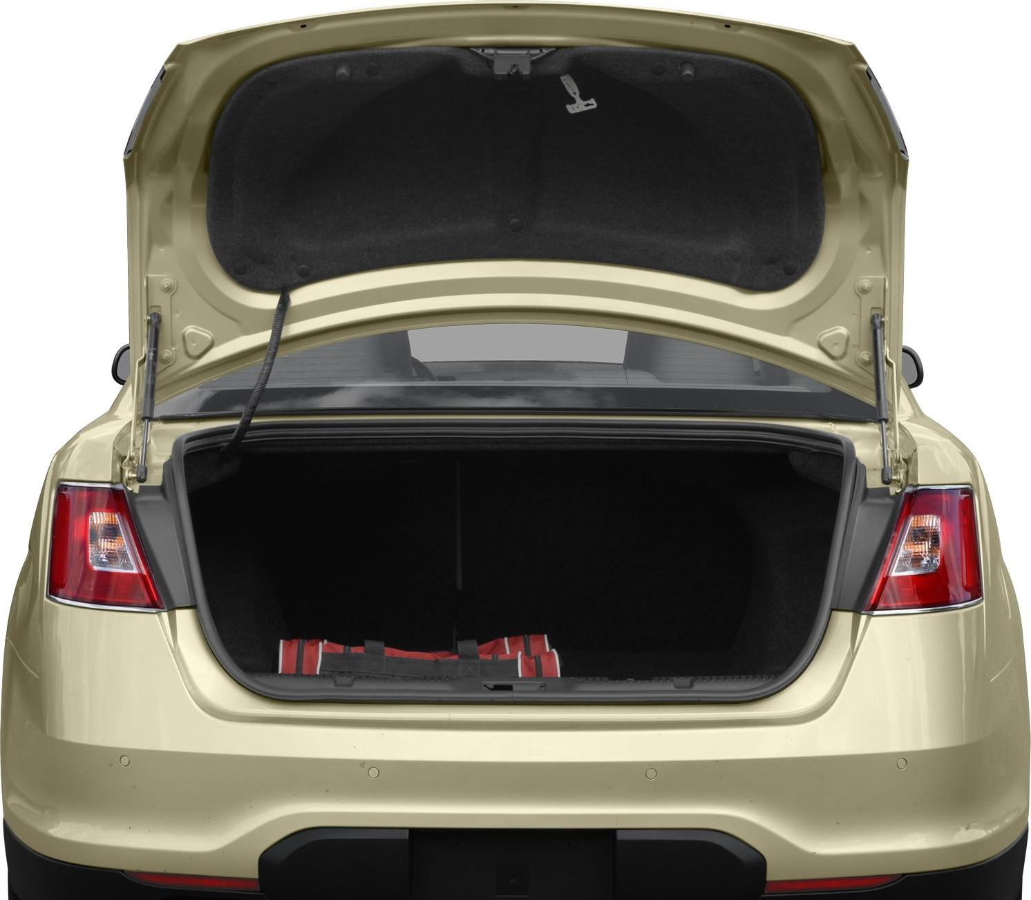 Open trunk with spacious rear storage and rear taillights in beige sedan