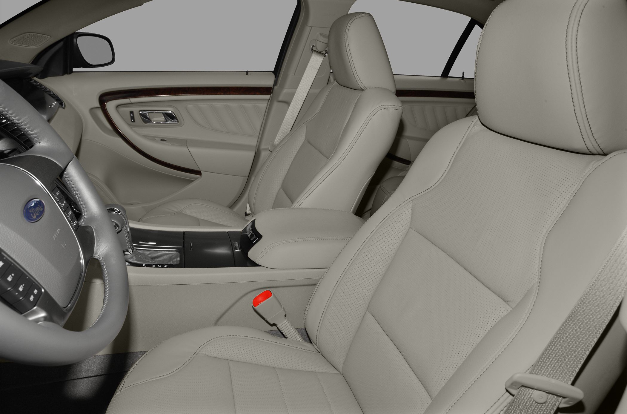Beige leather front seats and interior door panel with wood trim