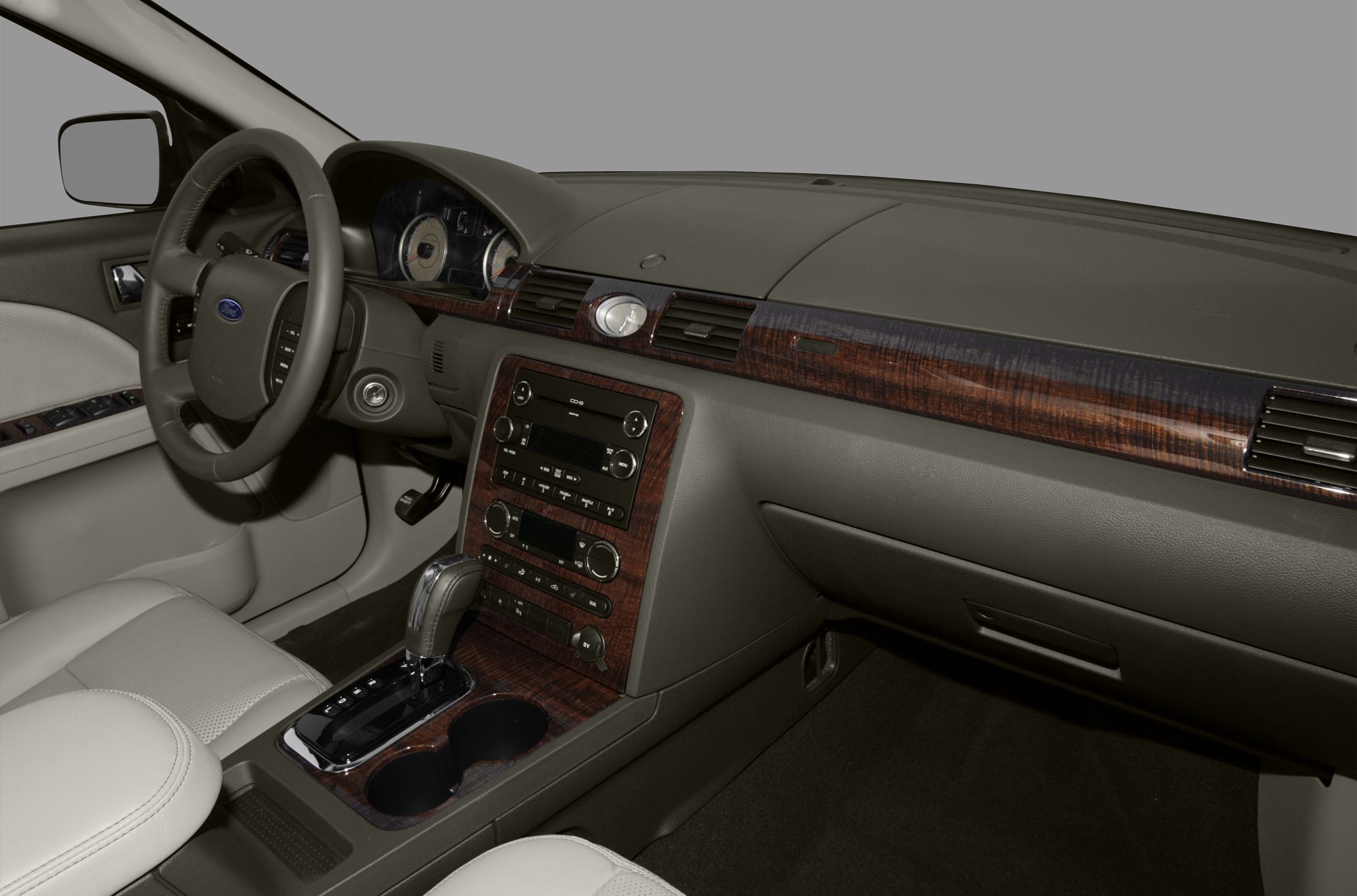 Interior with wood trim dashboard and center console with gear shift