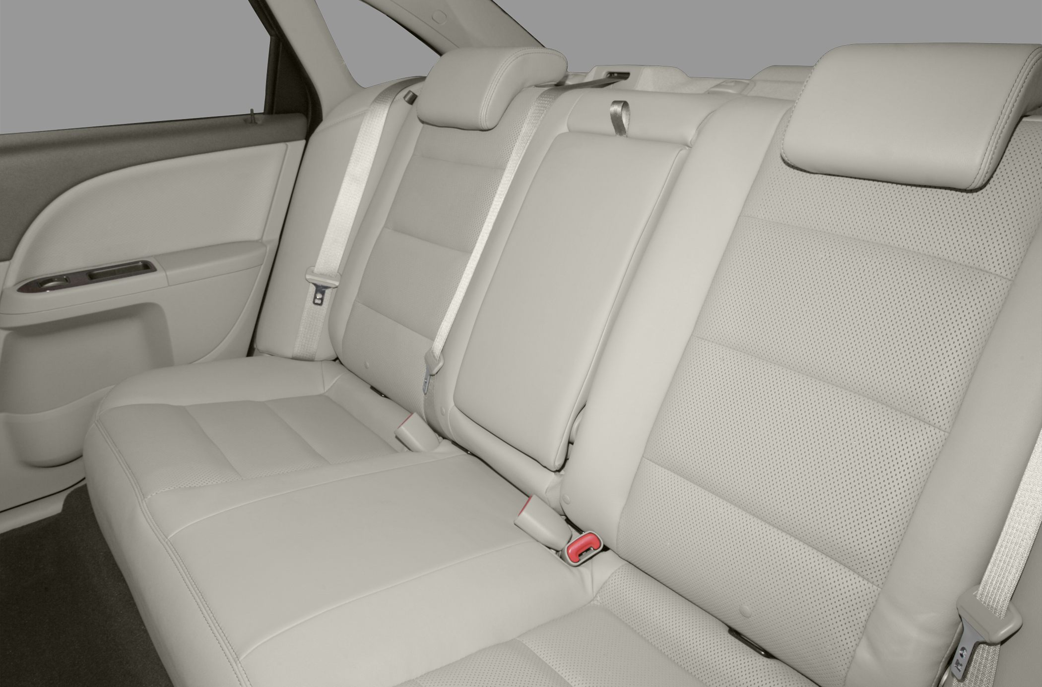 Beige leather rear seats with seat belts and headrests