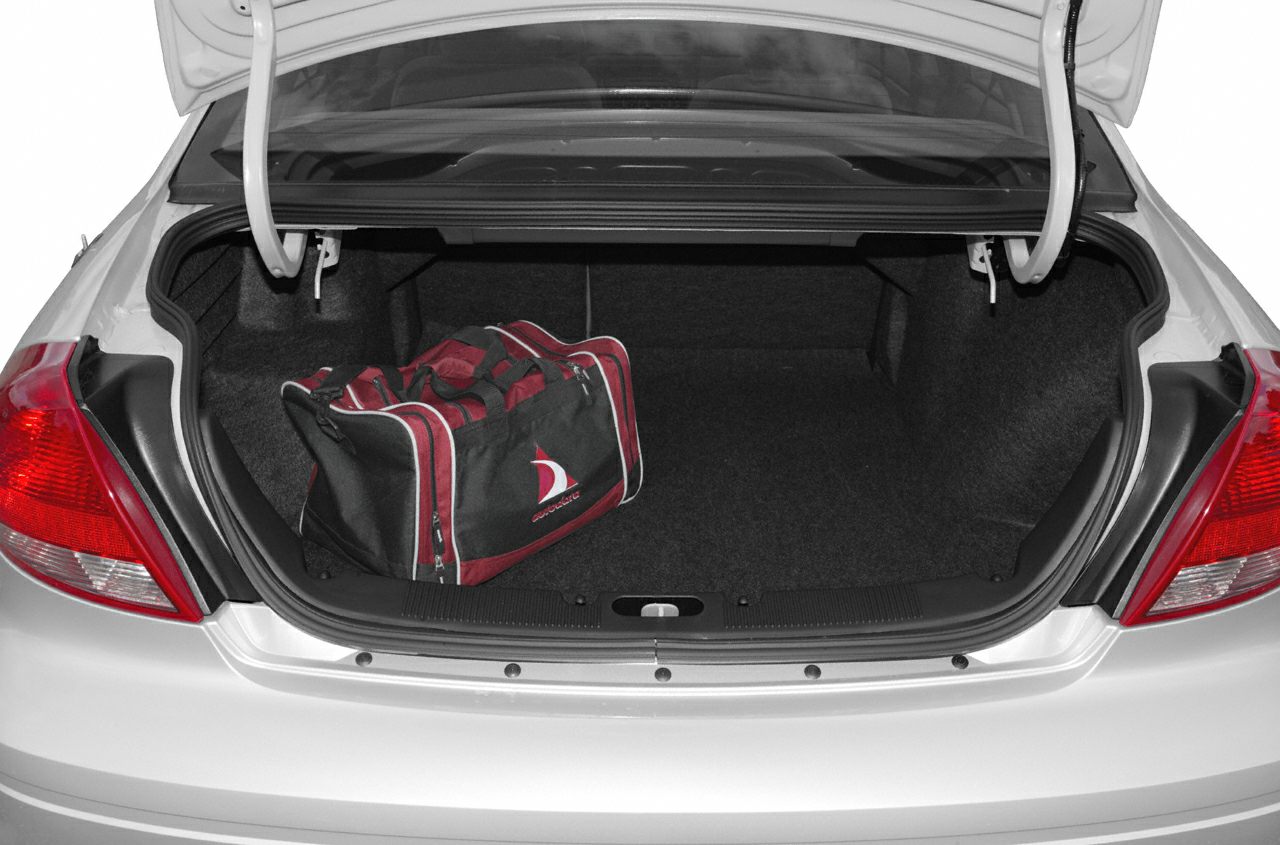 Open car trunk with a sports bag inside