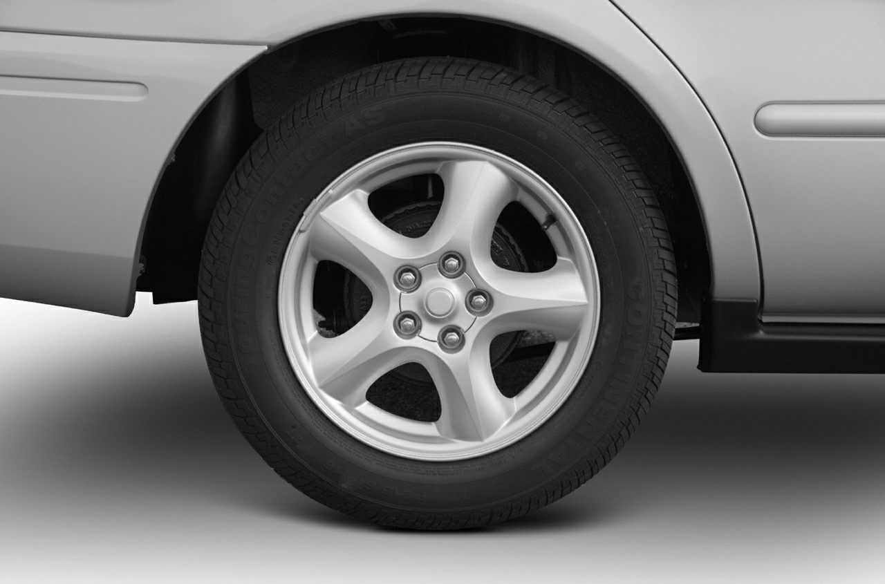 Alloy wheel and tire close-up with five-spoke rim design