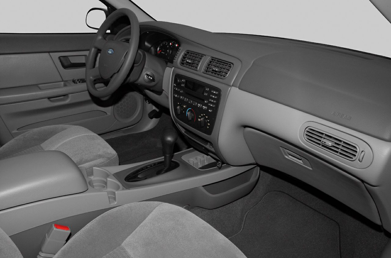 Dashboard layout with steering wheel and center console in vehicle interior