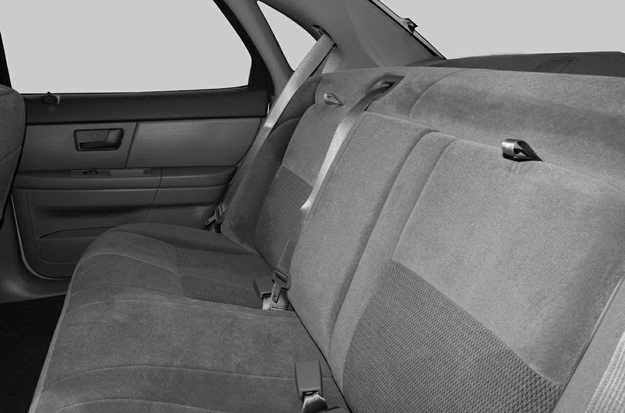 Spacious rear fabric seats with seat belts and door panel