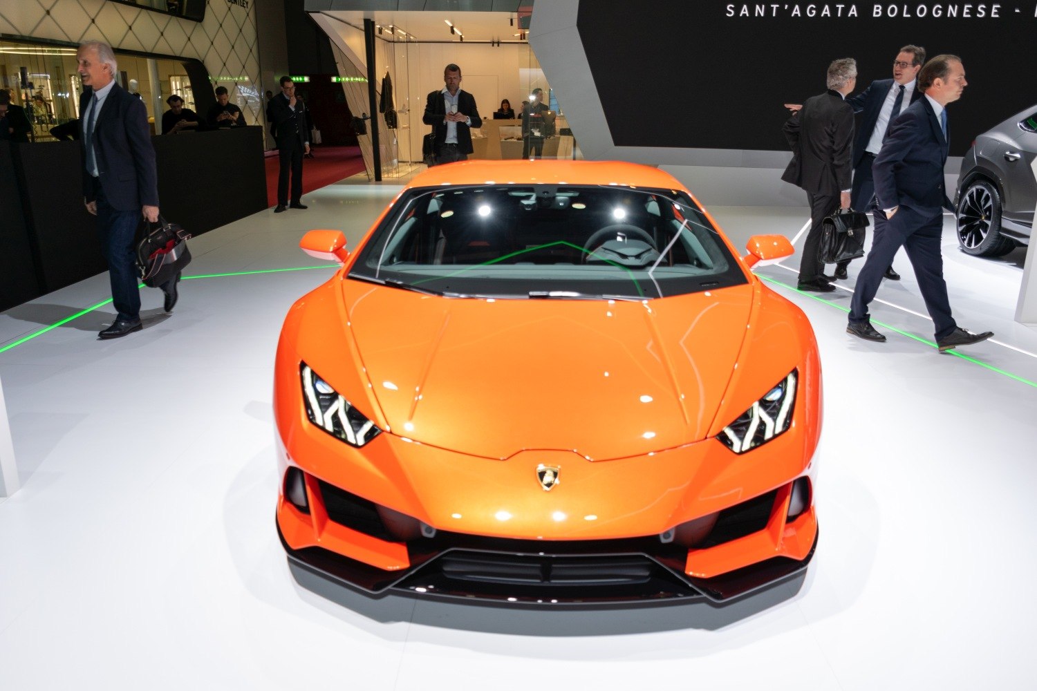 Front close-up of orange sports coupe with aggressive headlights