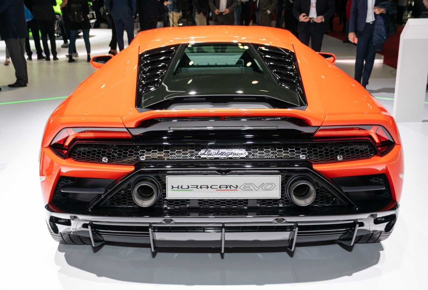Rear view with dual exhausts, diffuser, and engine cover vents