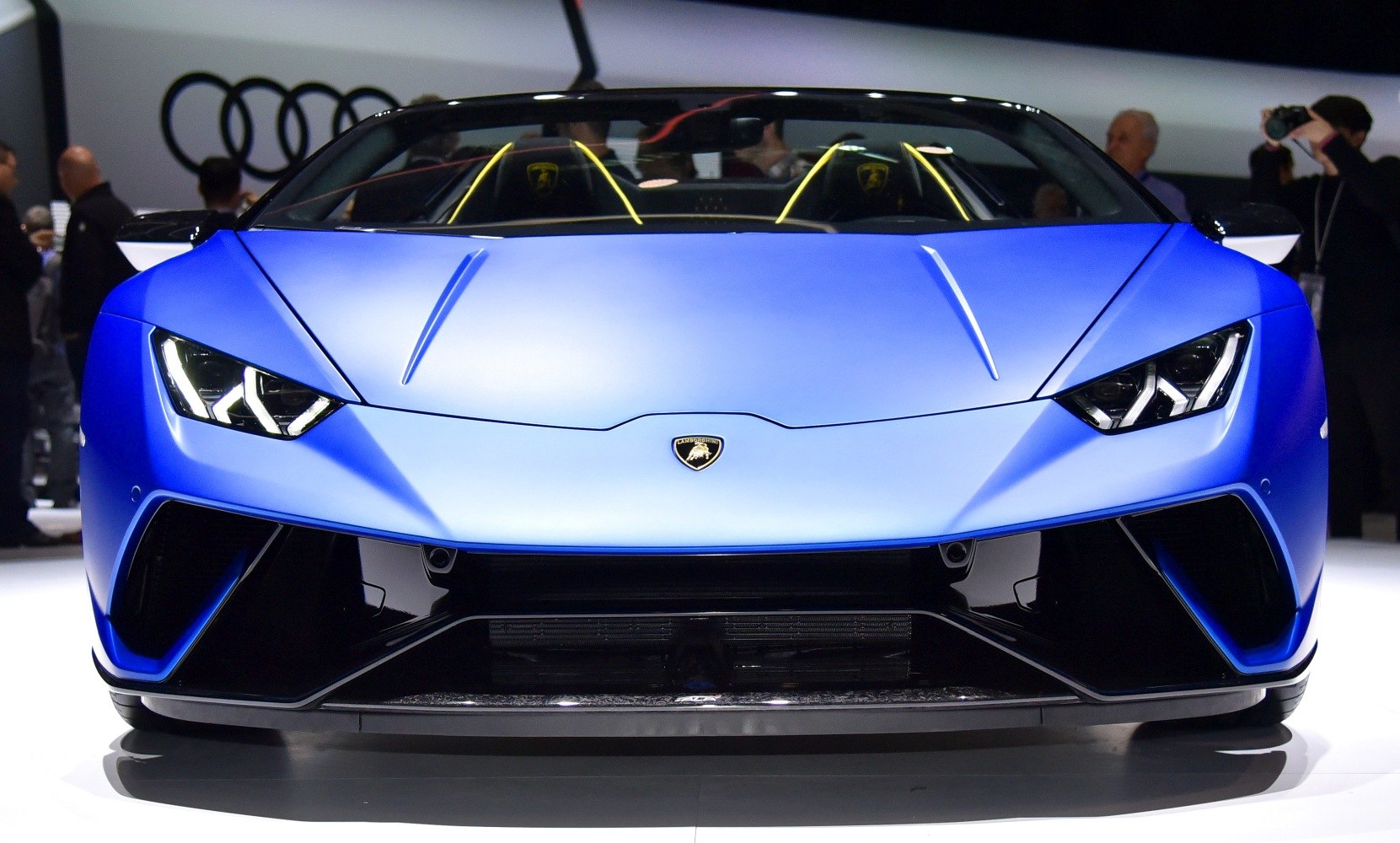 Front view with aggressive headlights and aerodynamic design
