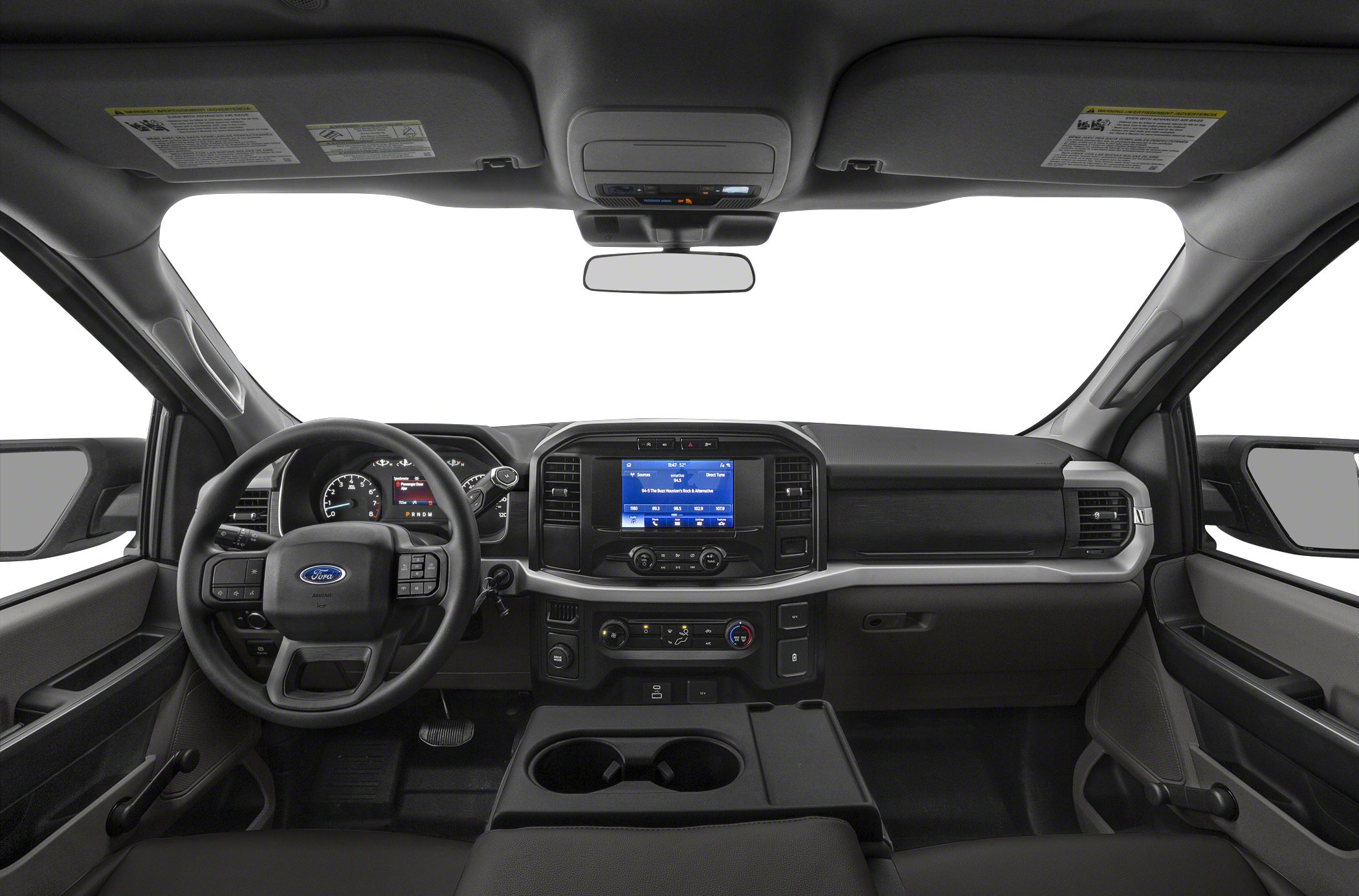 Modern truck interior with dashboard, touchscreen display, and steering wheel controls.