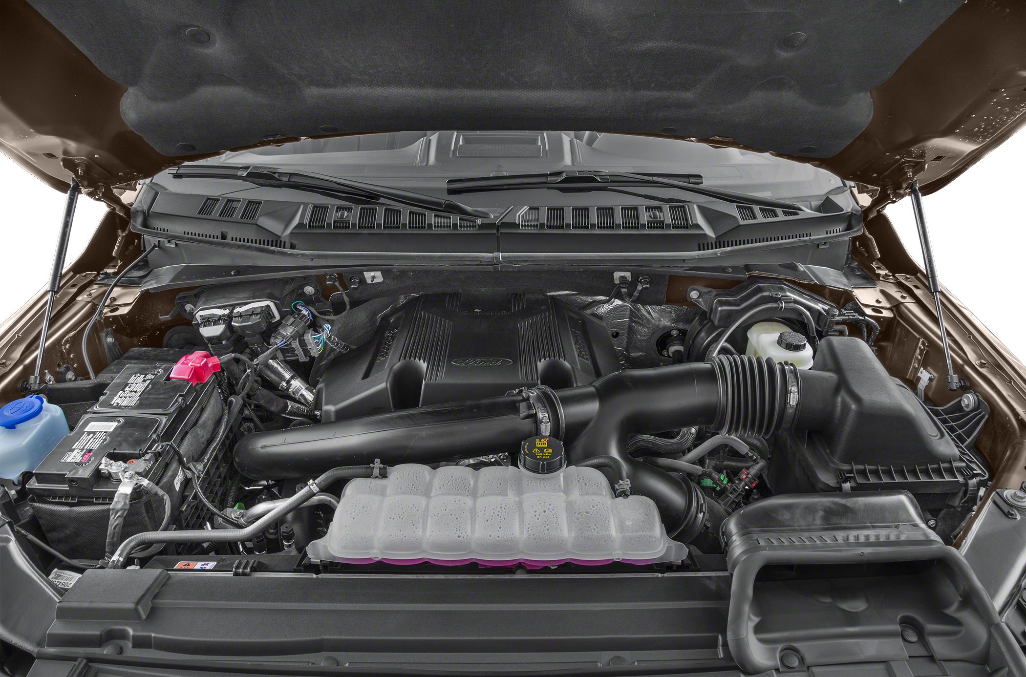 Engine bay with air intake system and coolant reservoir.