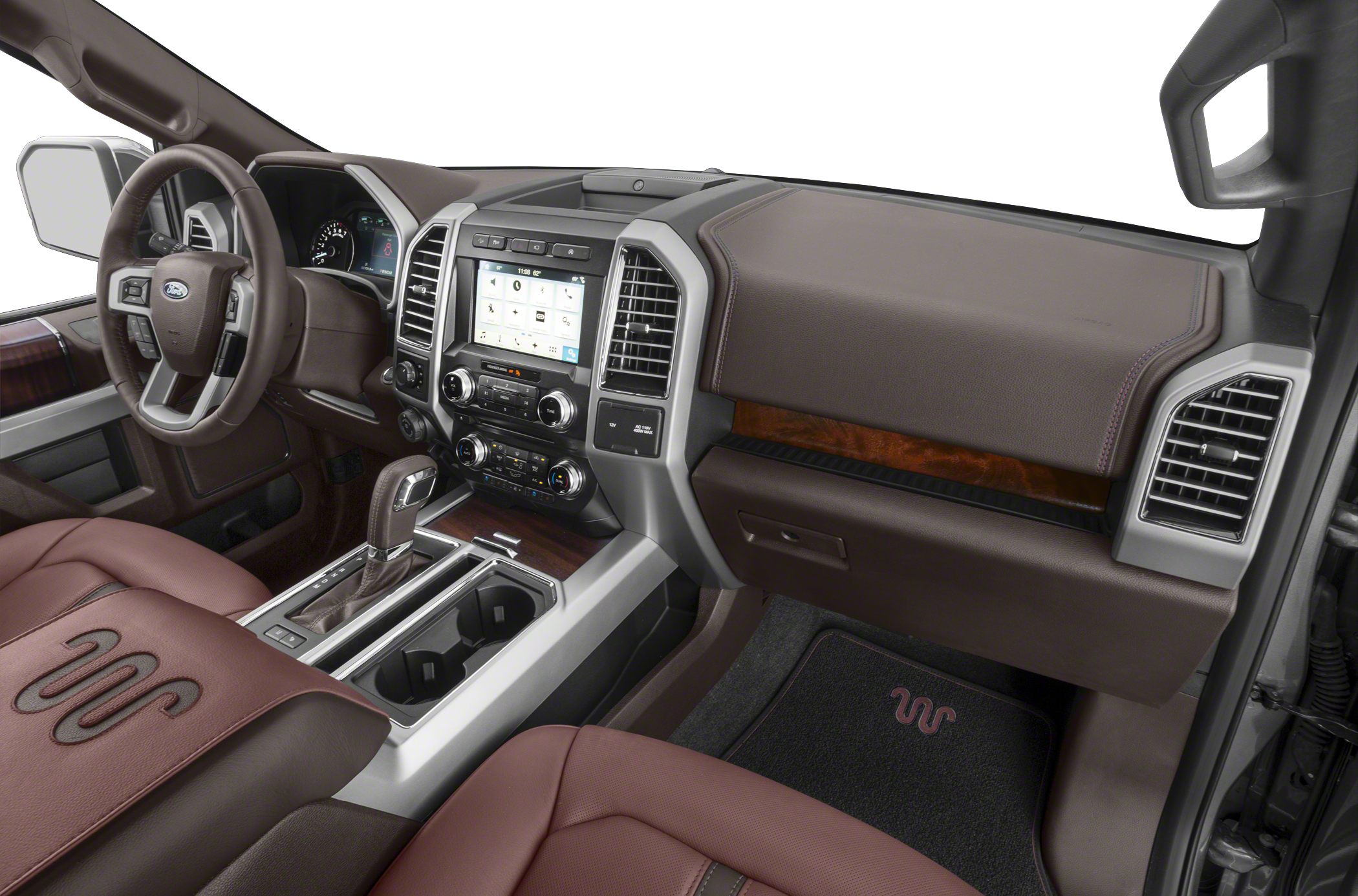 Truck interior with touchscreen dashboard, steering wheel controls, and leather seats