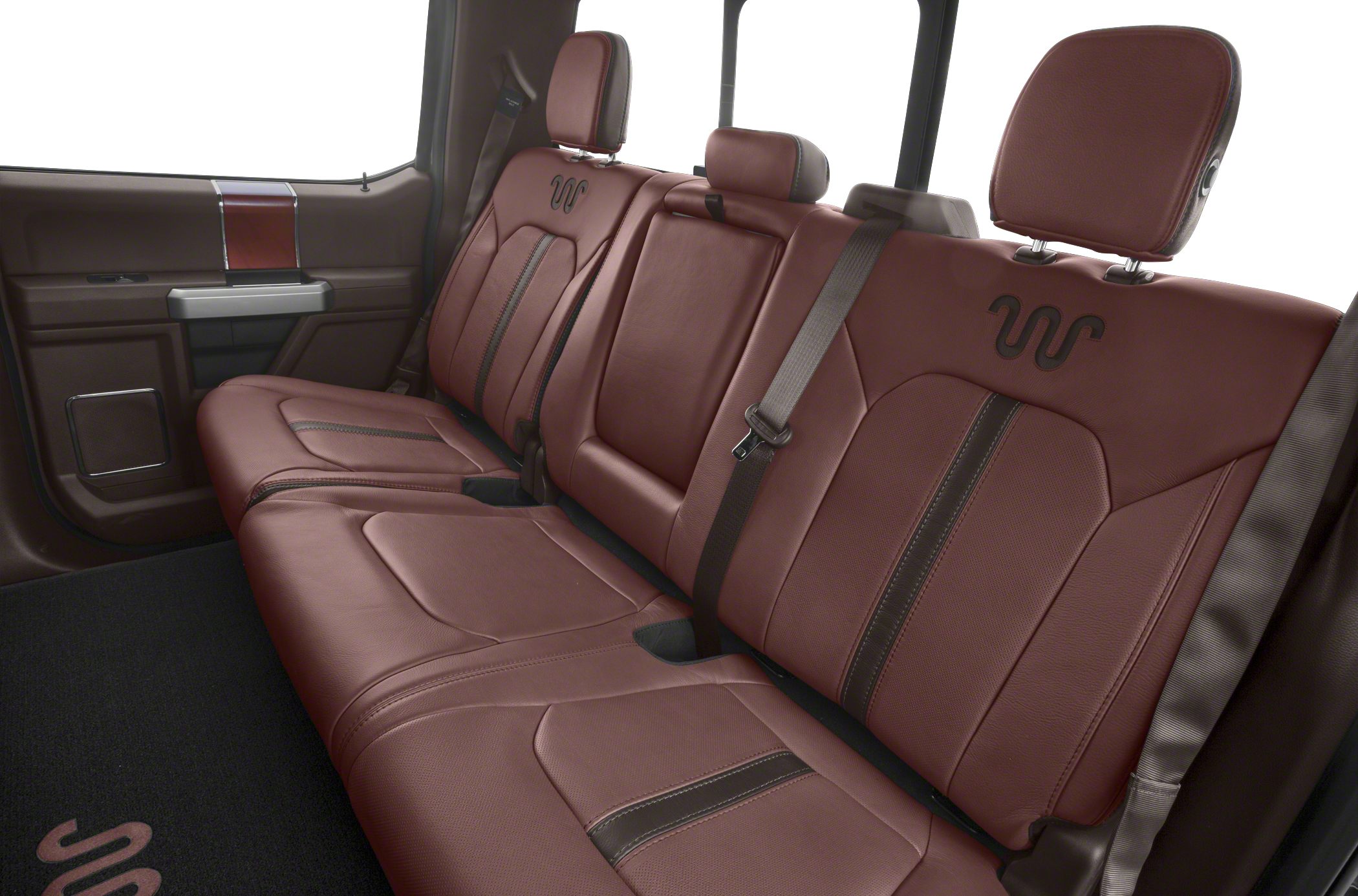 Brown leather rear seats with distinctive stitching and emblem