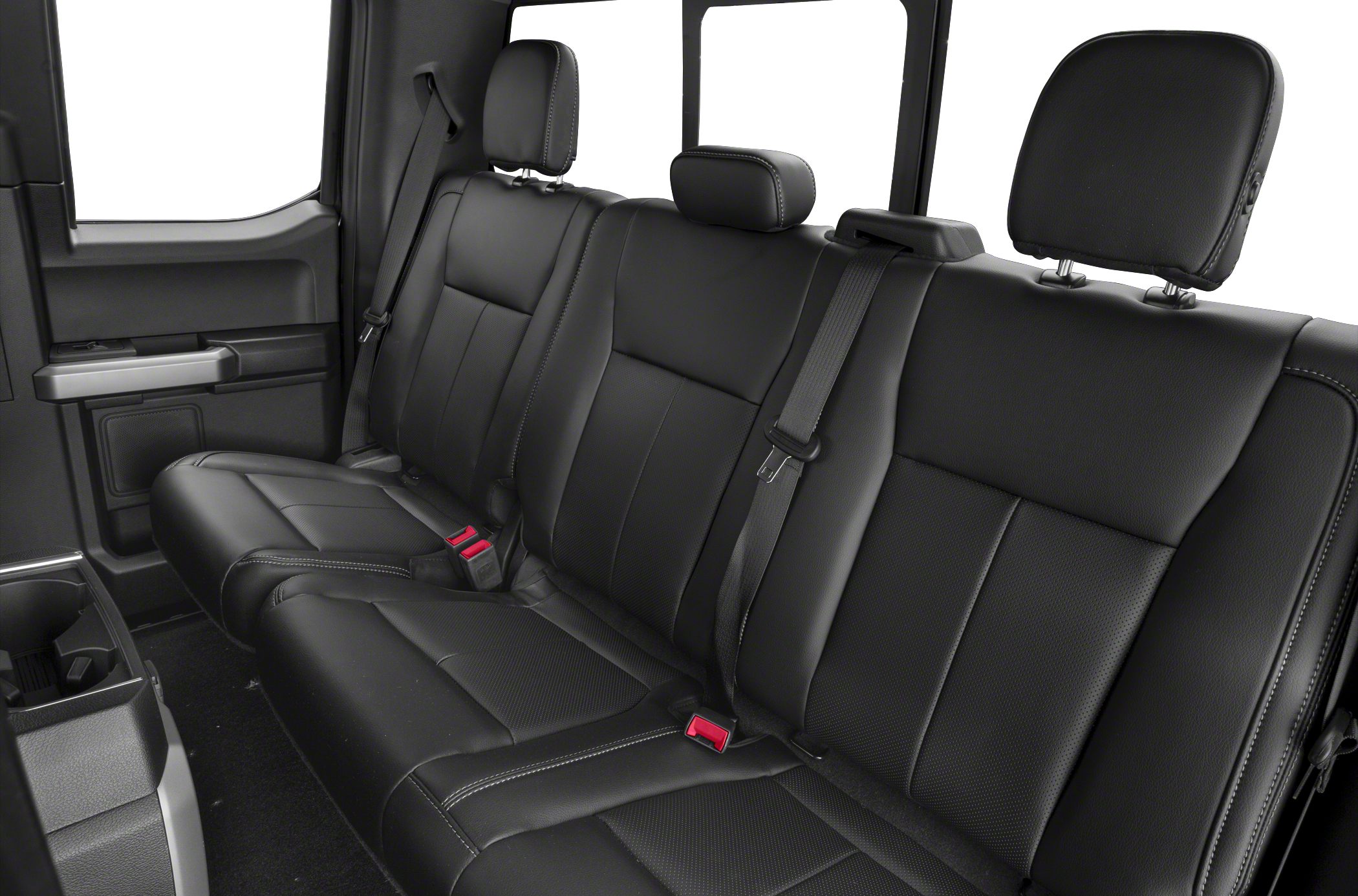 Black leather rear seats with three headrests and seat belts in pickup truck cabin