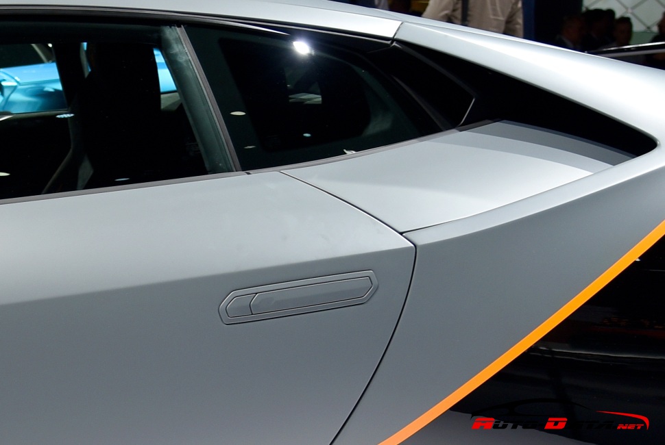 Close-up of sleek side door handle and window with sharp lines