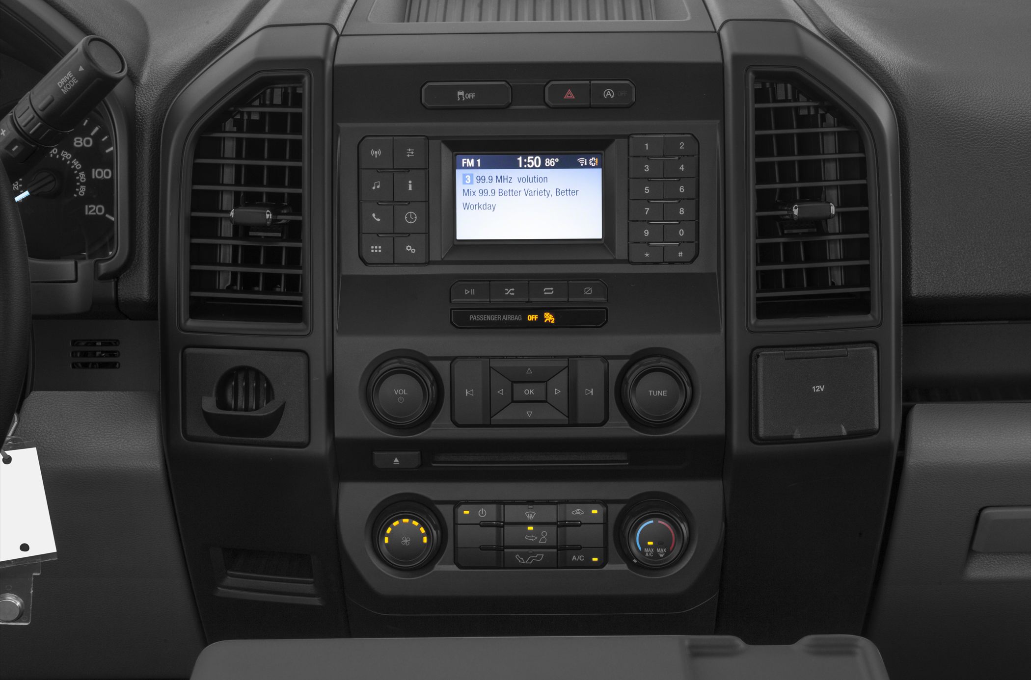 Car dashboard with media console and climate control knobs