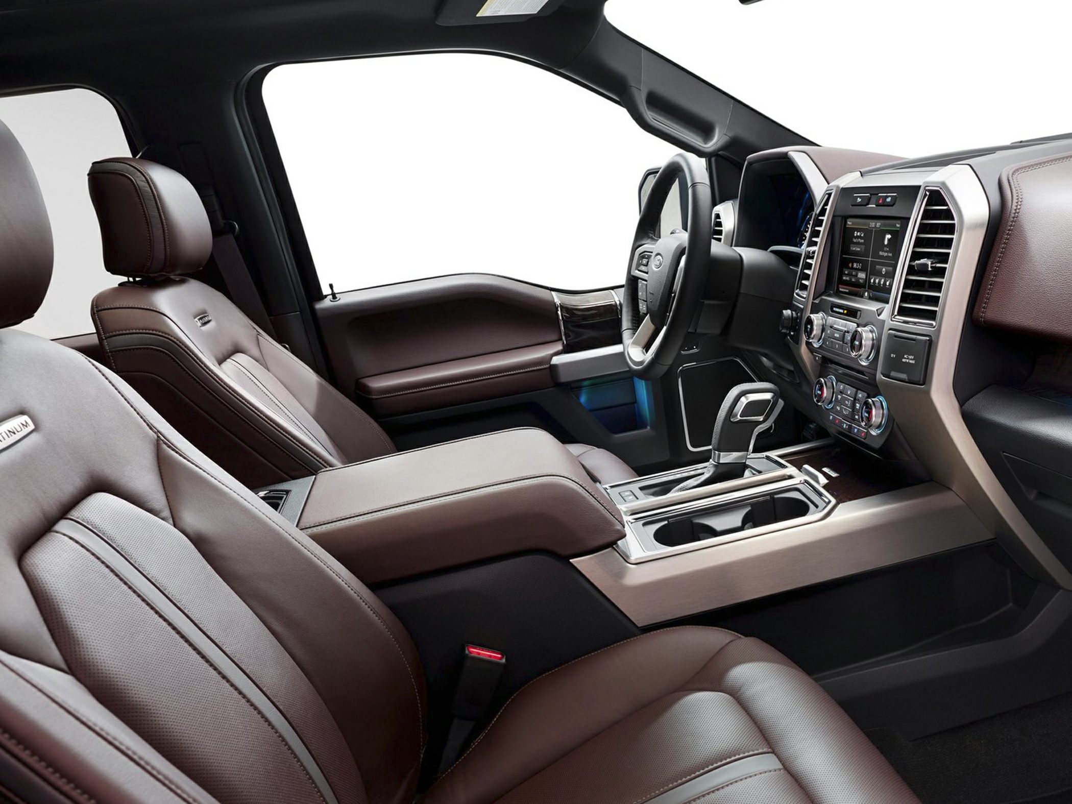 Interior with premium brown leather seats and tech-rich dashboard.