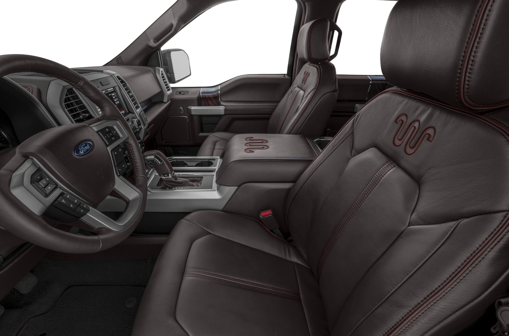Brown leather seats with embroidered design, advanced dashboard, and center console.