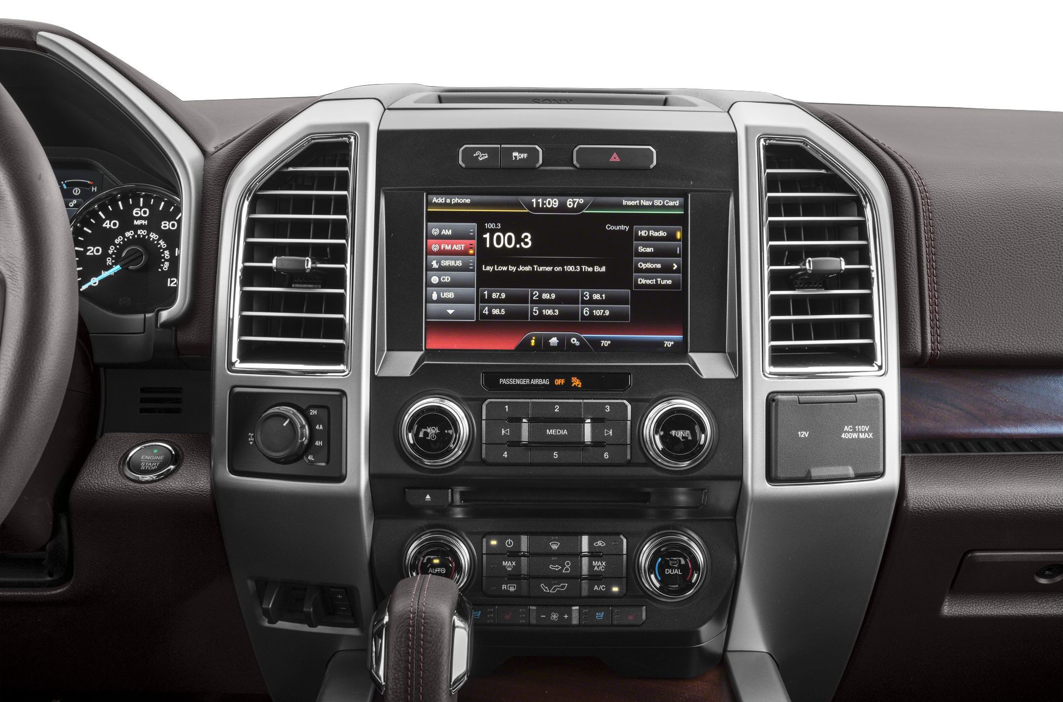 Infotainment screen, climate control, 4x4 selector, gear shifter, dashboard layout