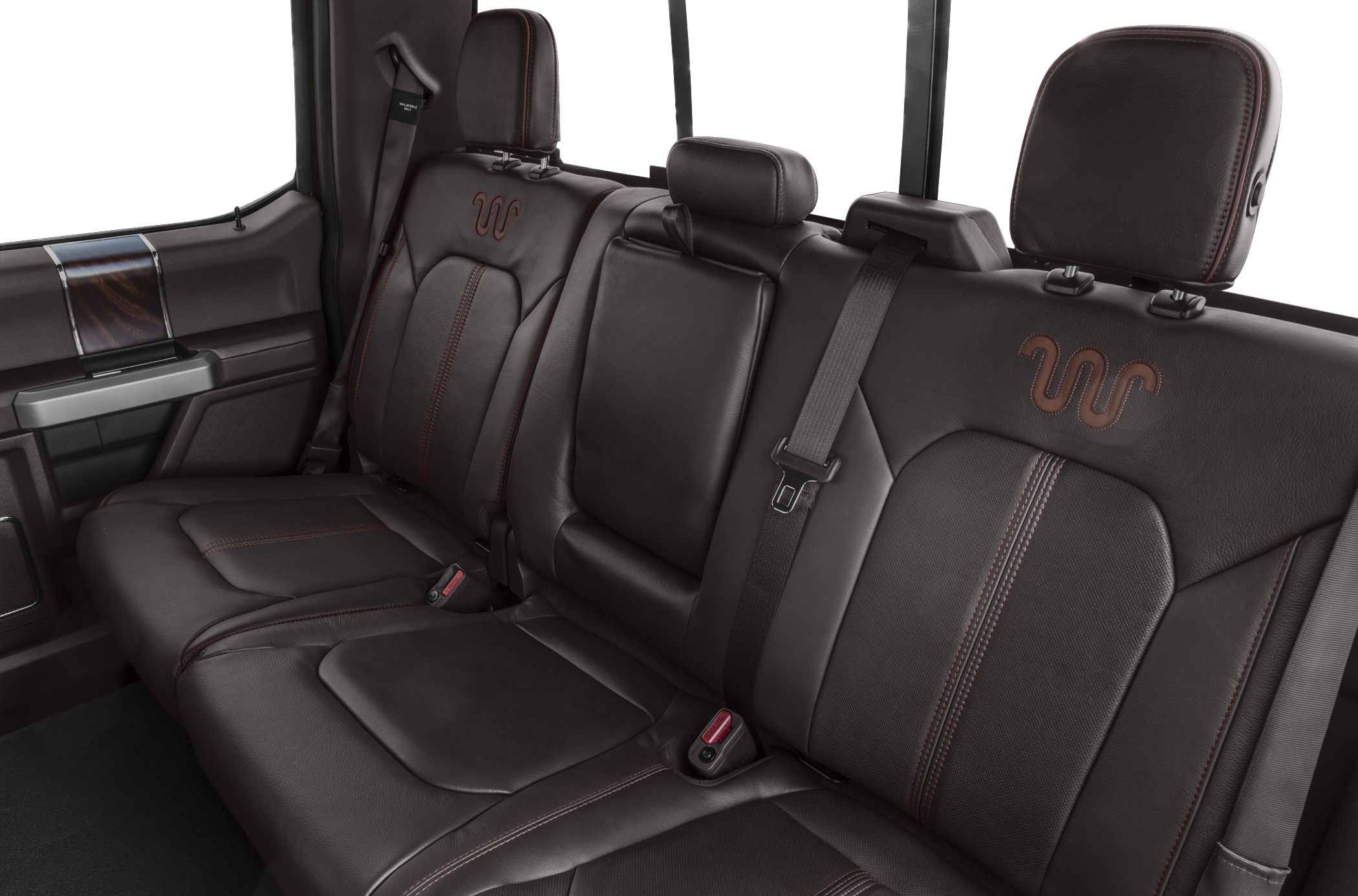 Brown leather rear seats with stitching and seat belts