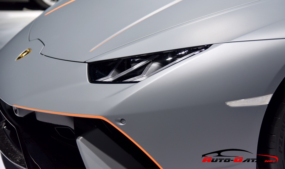Sharp front headlight and aerodynamic front bumper lines with detailed trim.