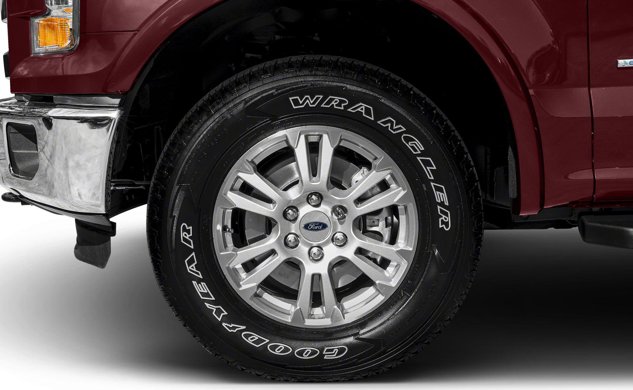 Alloy wheel with Goodyear Wrangler tire on truck