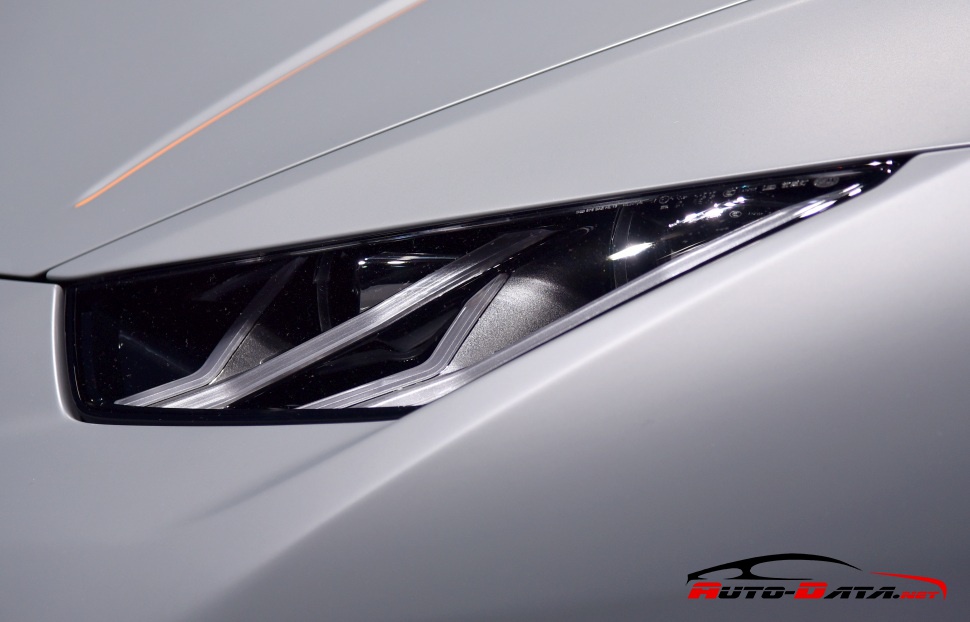 Close-up of sleek angular headlight design.