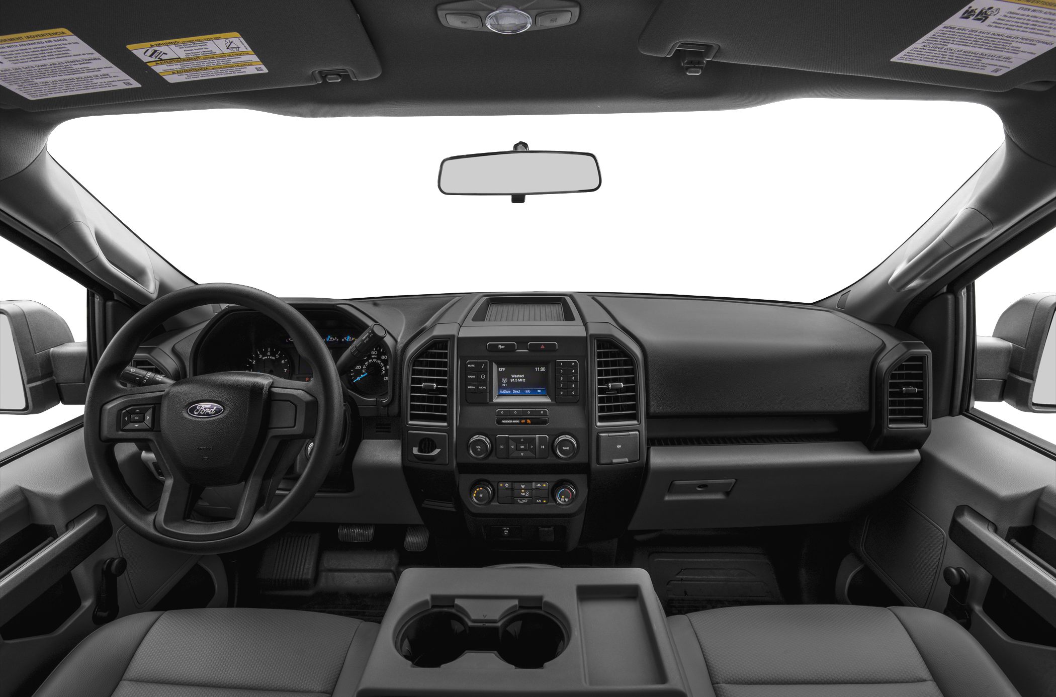 Dashboard and steering wheel with center console and dual cup holders.