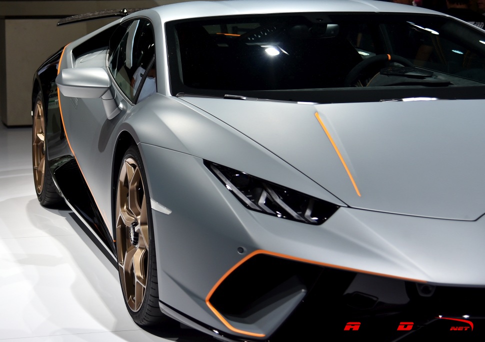 Close-up of front headlight and aerodynamic body lines with accent details