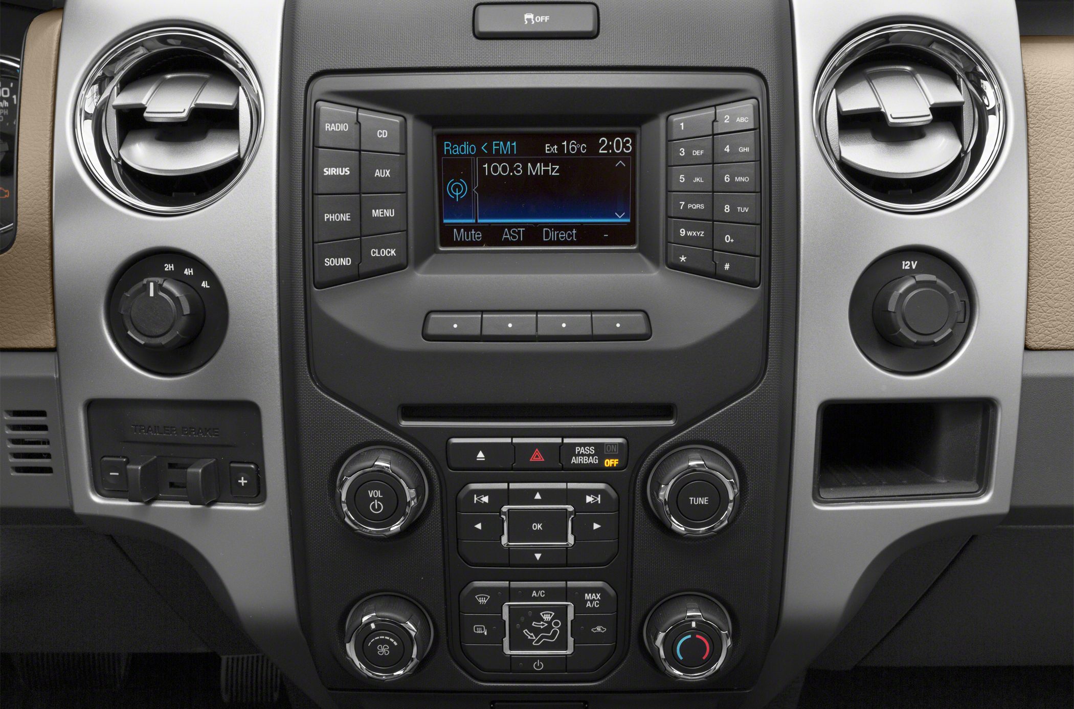 Center console with radio, climate controls, and 4WD selector knobs.