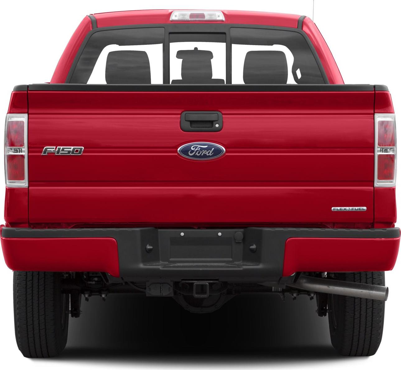 Red pickup truck rear view with tailgate, taillights, and exhaust pipe