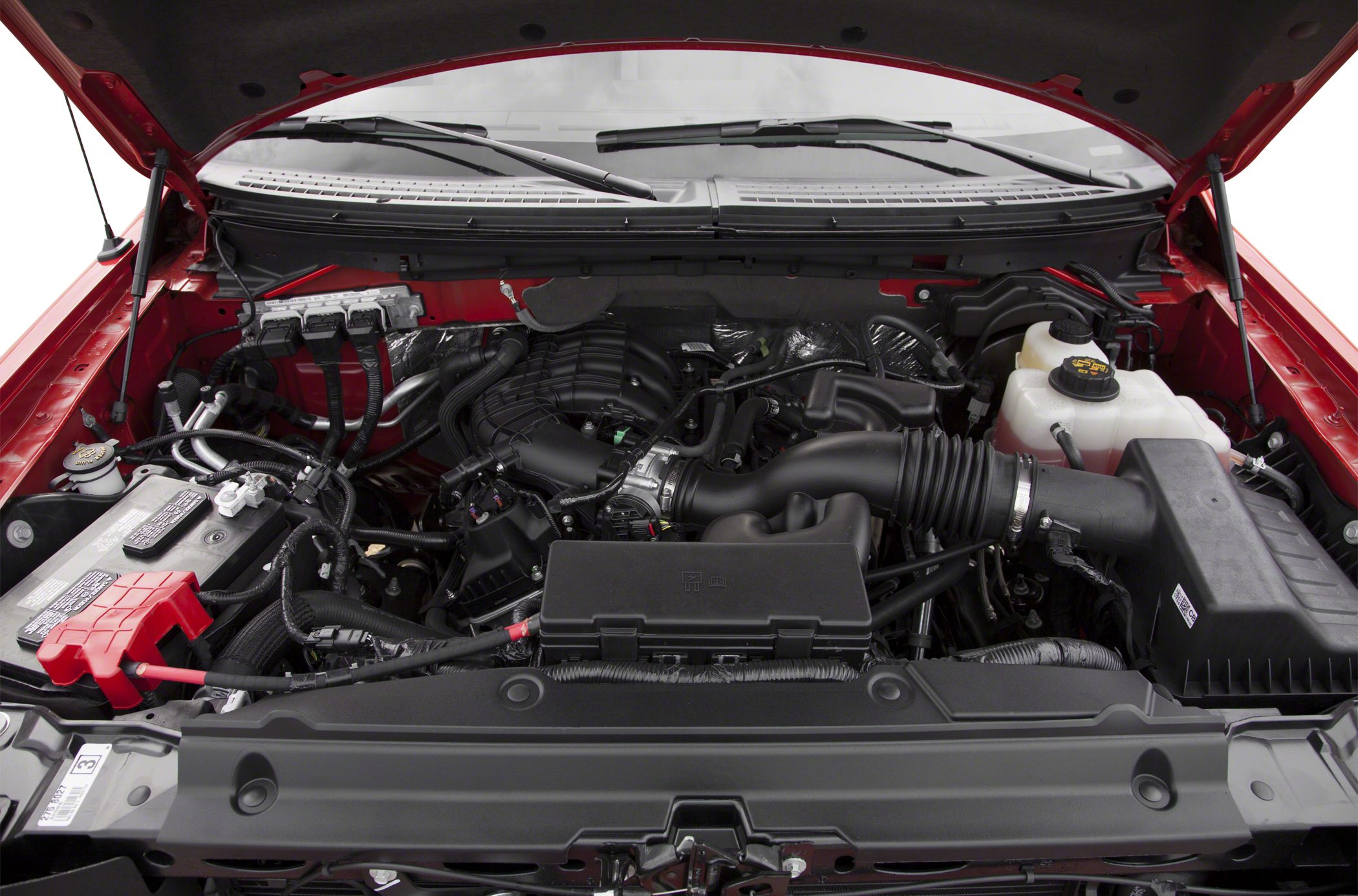 Engine compartment with intake system and battery layout.