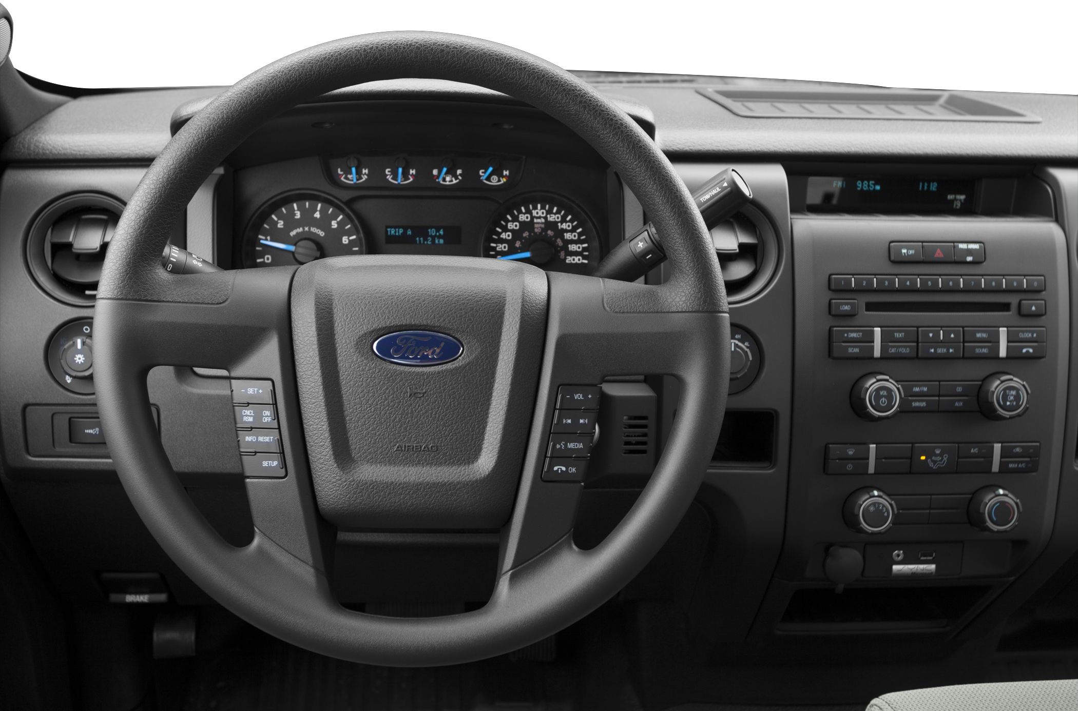 Dashboard and steering wheel with control buttons and instrument cluster