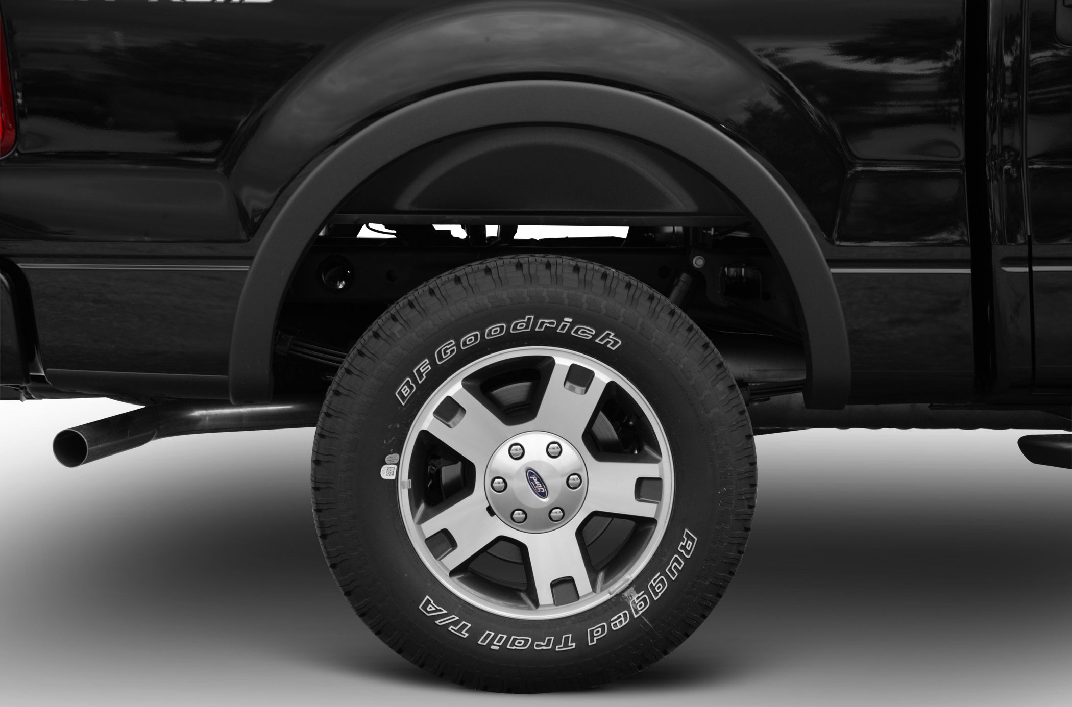 Close-up of alloy wheel with BFGoodrich Rugged Trail tire on black truck