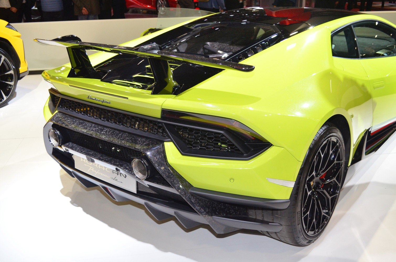 Rear view with large spoiler, aerodynamic diffuser, and dual exhausts