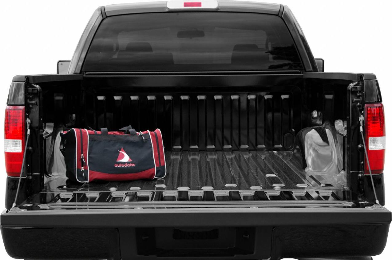 Open pickup bed with tailgate down and duffel bag inside