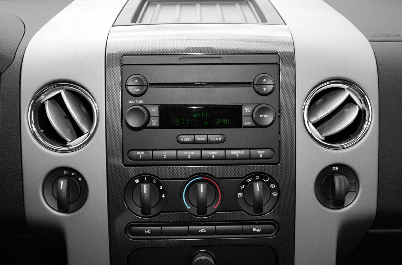 Center console with stereo system, air vents, and climate control knobs