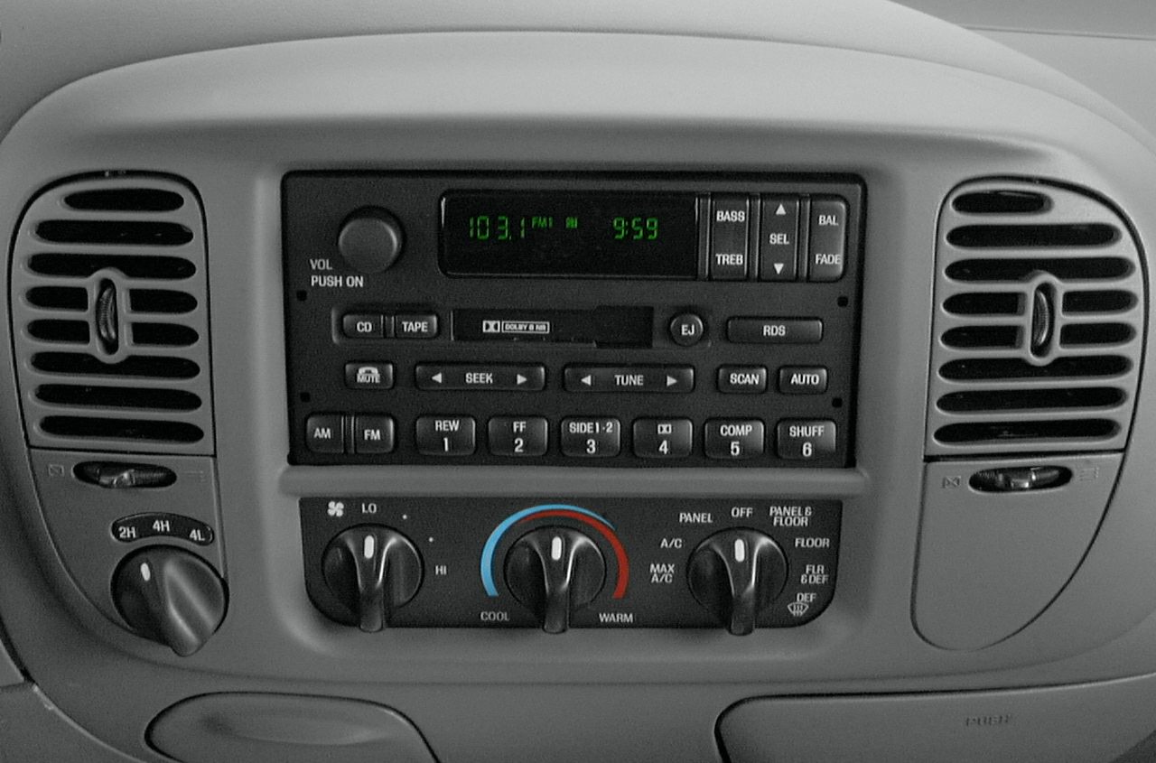 Dashboard radio and climate control knobs with air vents