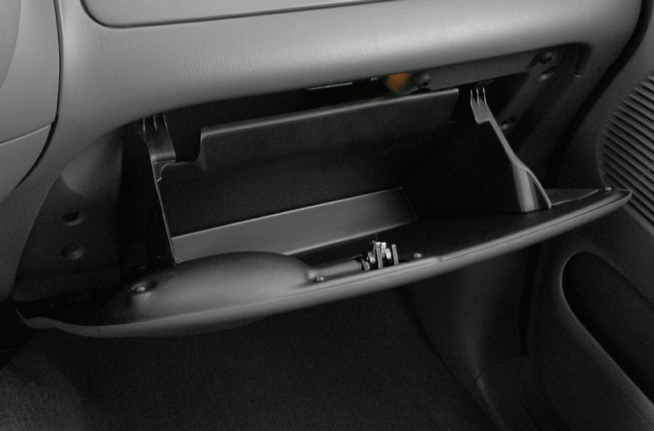 Open glove compartment inside vehicle cabin