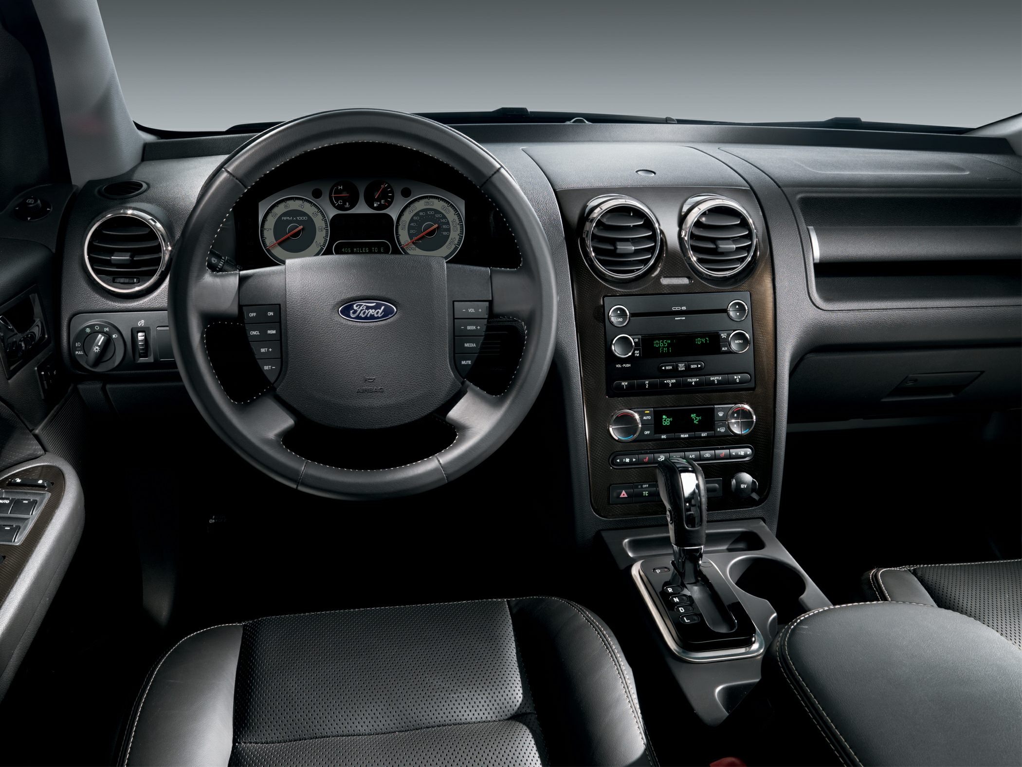 Steering wheel and dashboard with center console and gearshift