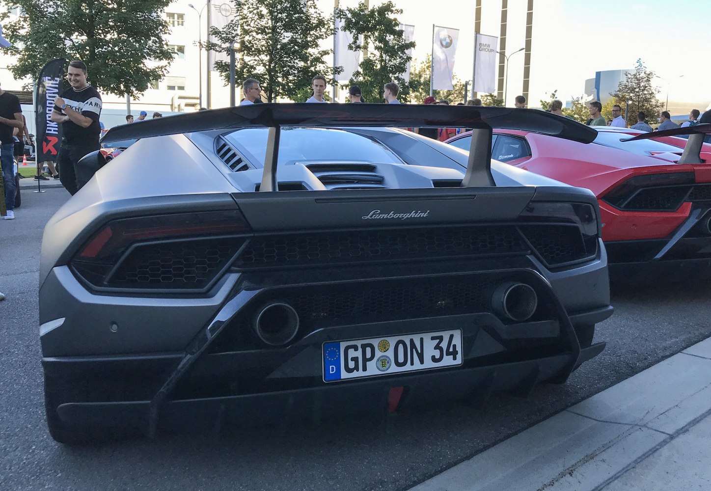 Prominent rear wing and dual exhausts on sports car rear