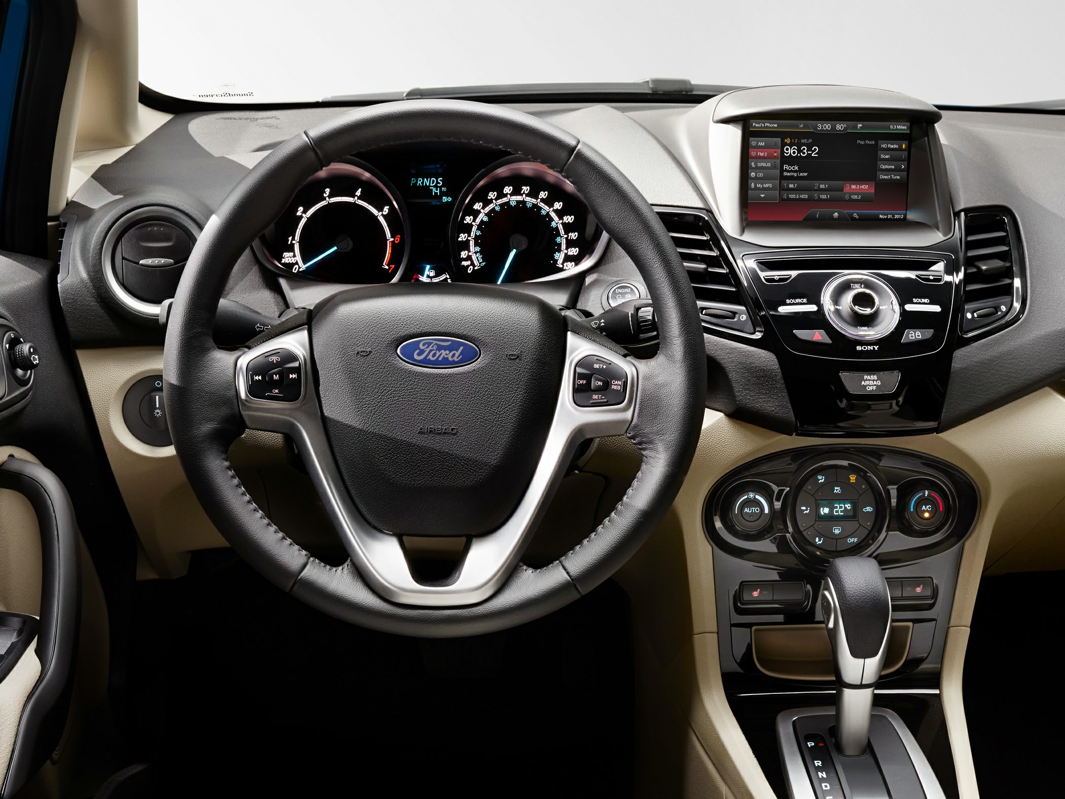 Steering wheel with multifunction controls and center console with digital display and climate control