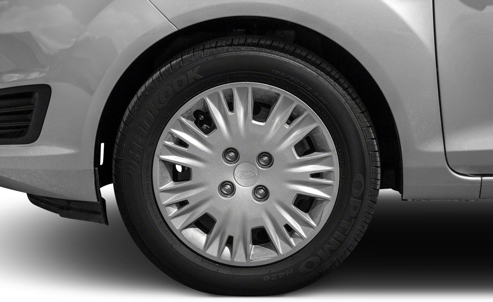 Close-up of Ford hubcap and tire design on wheel
