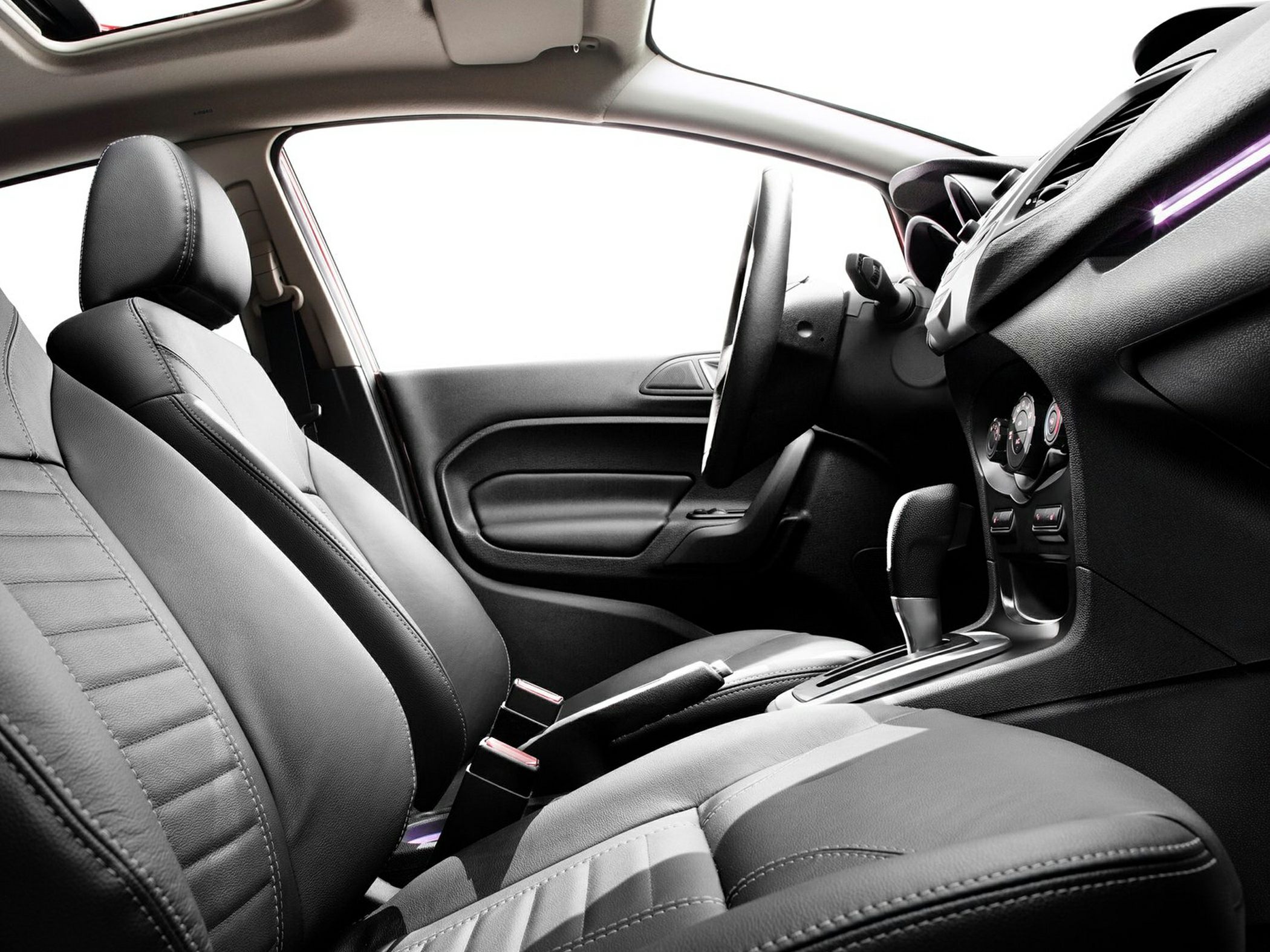 Leather seats and gear shift inside a vehicle interior