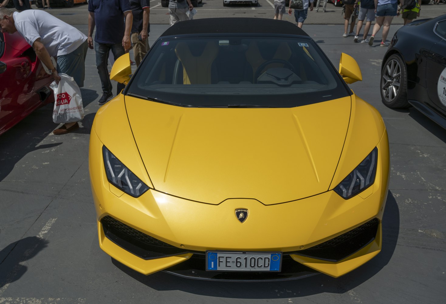 Yellow Lamborghini Huracan LP 610-4 Spyder front with aggressive headlights, convertible roof.