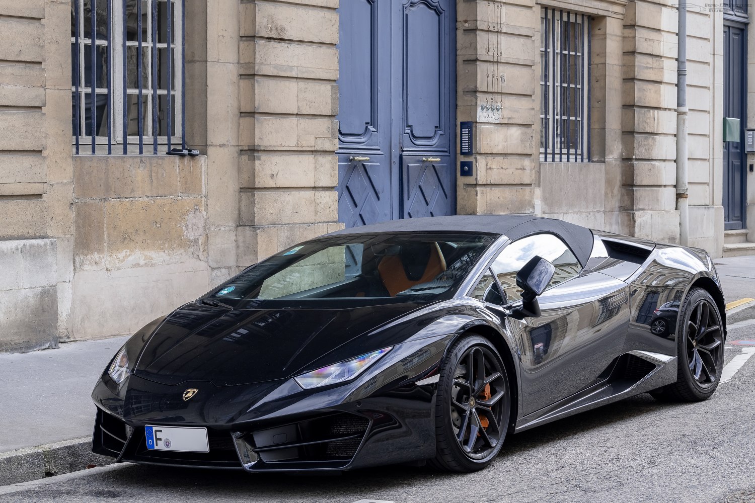 Black convertible sports car with sharp front and aerodynamic design