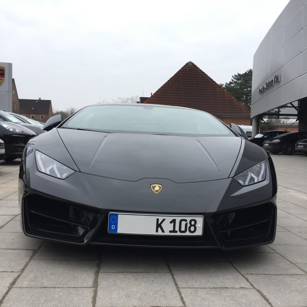 Front view with aggressive headlights and aerodynamic hood design