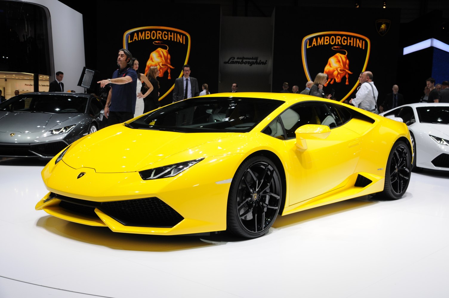Yellow sports coupe with sharp angular design and black alloy wheels.