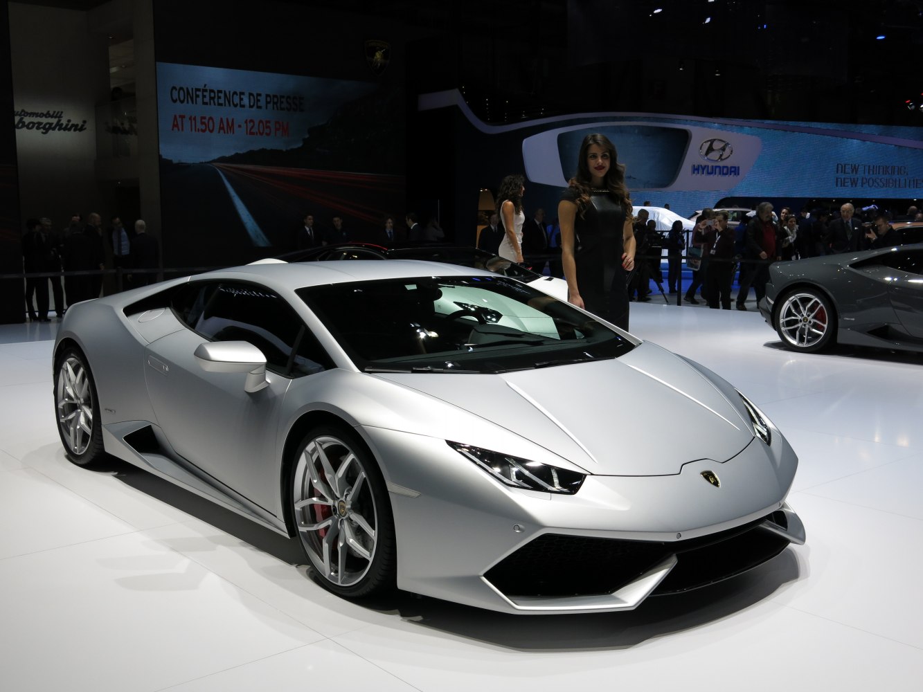 Silver sports coupe with angular headlights and aerodynamic design