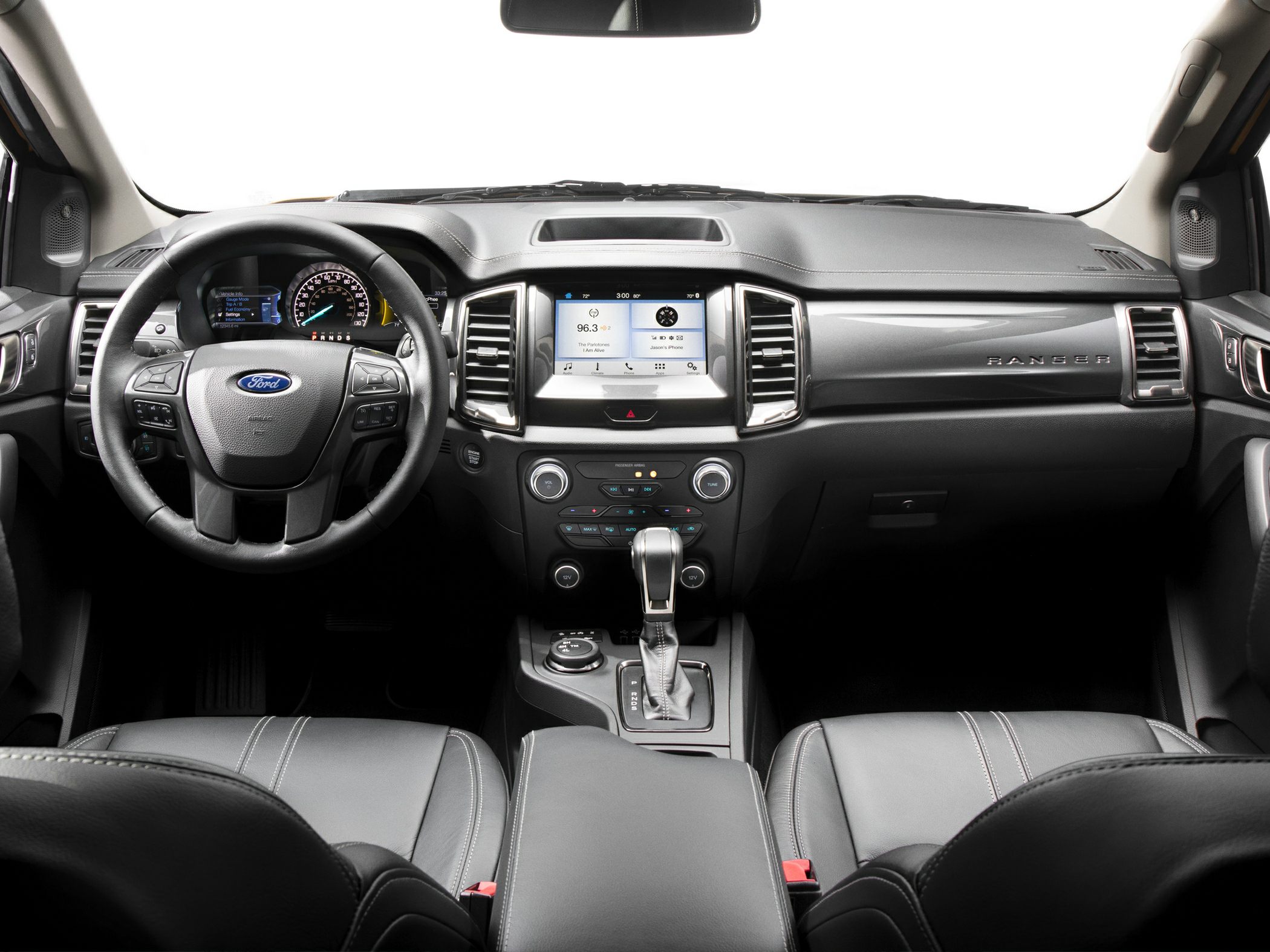 Interior view featuring dashboard, touchscreen display, and multifunction steering wheel