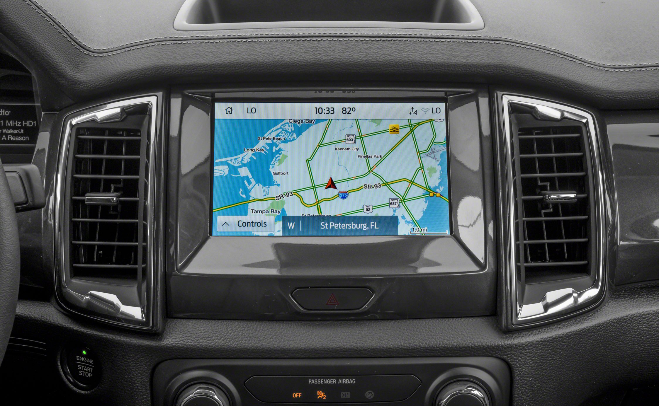 Touchscreen navigation system with dual air vents on dashboard